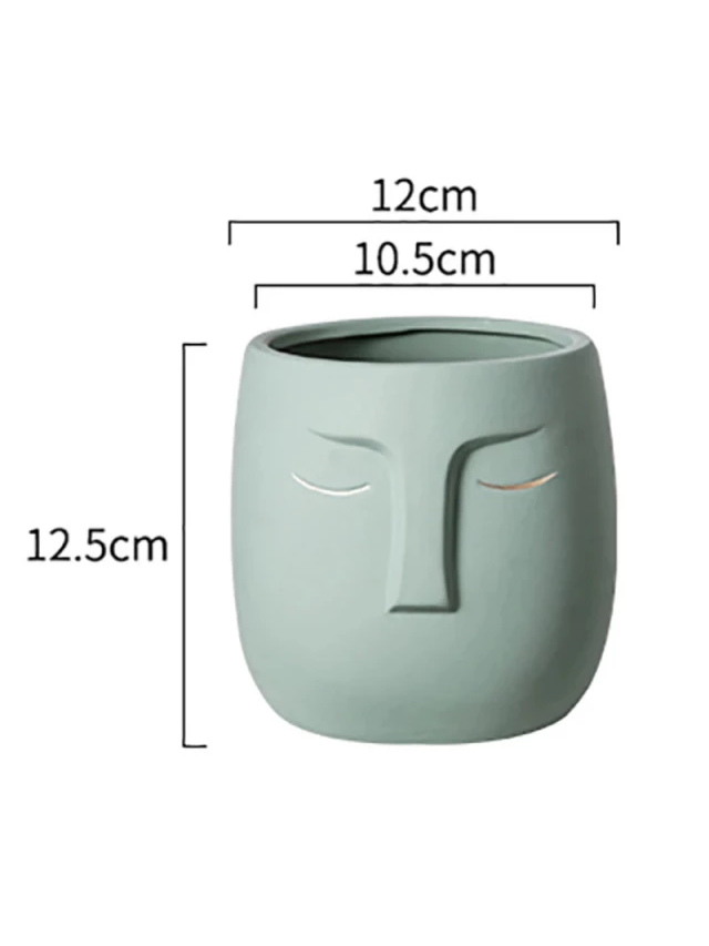 Keramikkpotte med drenshull  ansikt